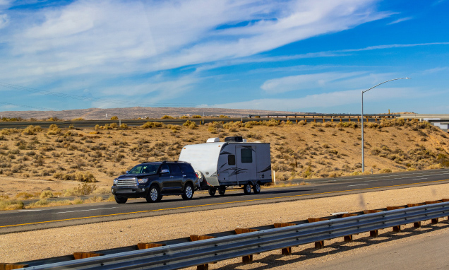 Truck pulling a travel trailer in the desert