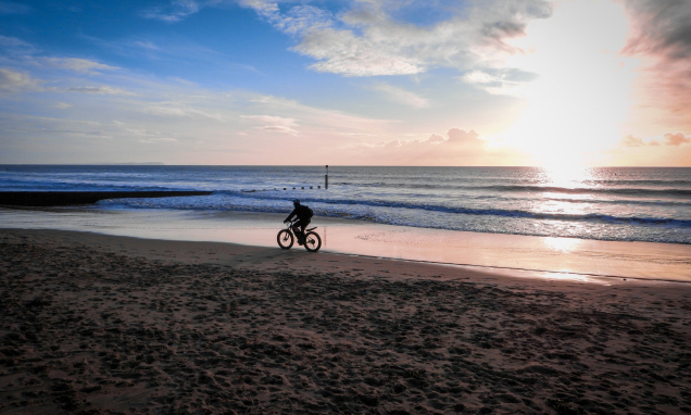 Riding a bike on the beach