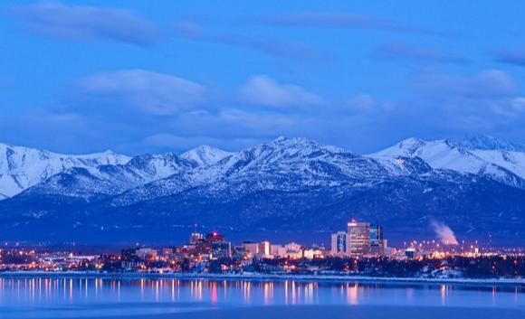 View of snowy mountains behind the city of Anchorage